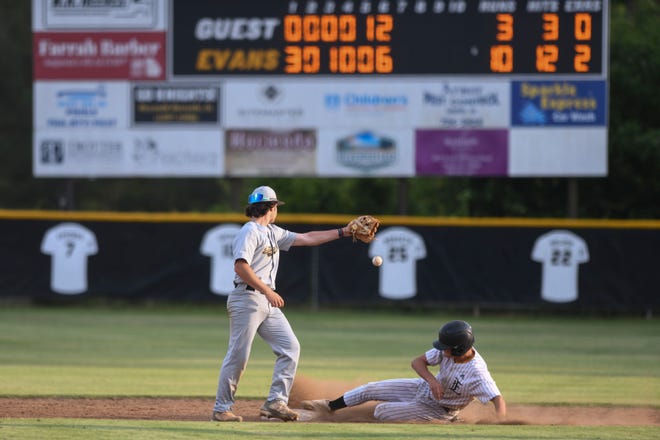 Evans' Jackson Denton (3) slides into second as Alcovy second baseman Dylan Lester (3) drops the ball during the first game of the Evans and Alcovy 6A double header playoff at Evans High School on Thursday, April 25, 2024. Evans won the first game 10-6.